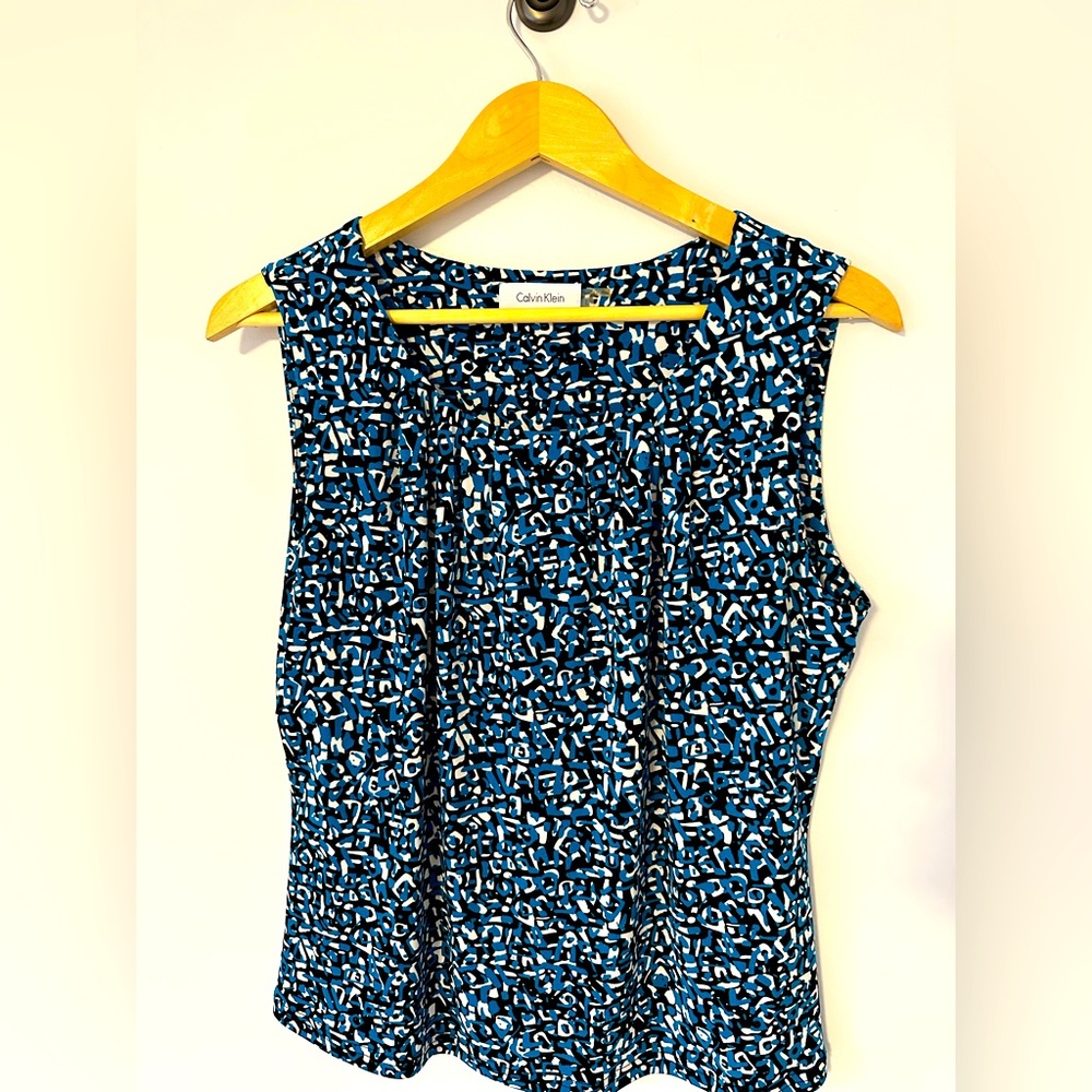 Sleeveless blouse size L, worn a couple times but in excellent condition.